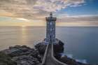 France-Brittany-Le Conquet Sun setting at the Kermorvan Lighthouse Coastal Print